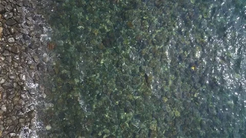 Water flowing into the ocean 스톡 동영상 310298937