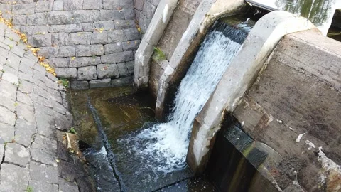 Water flowing in old dam construction in Mustola, Lappeenranta Finland Stock-Footage 140170181