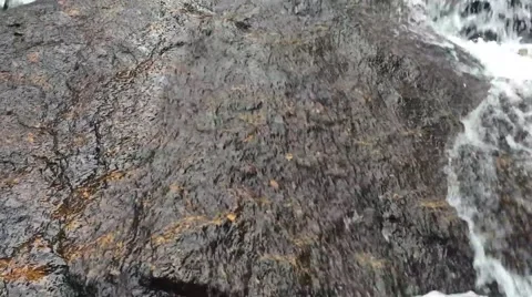 Water Flowing Over A Boulder Stock Footage 41169487