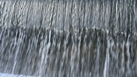 The water flowing over the concrete dam Stock Footage
