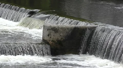 Water flowing over dam wild rapids foam movement Stock Footage 65342821