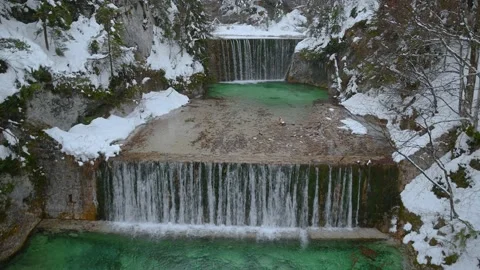 Water flowing over man made waterfalls in Kranjska Gora, Slovenia Video stock 145453702