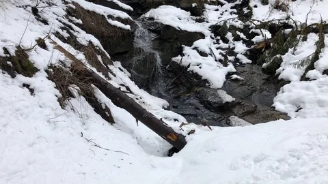 Water flowing over a mountain stream on France Alpes Stock Footage 127136922