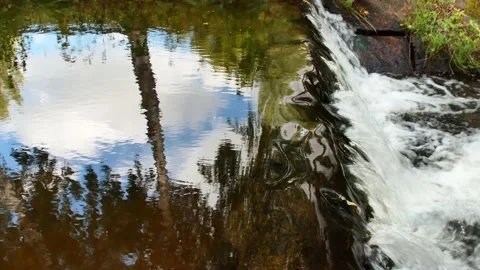 Water flowing over an old stone dam construction Stock-Footage 206289937