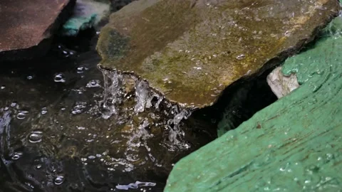 Water flowing over the rock Stock Footage 210027630