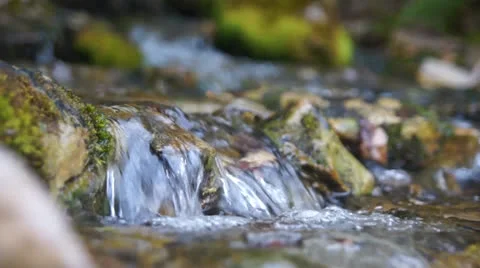 Water flowing over rocks Stock Footage 22674077