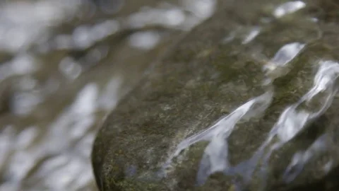 Water flowing over rocks Stock-Footage 74907901