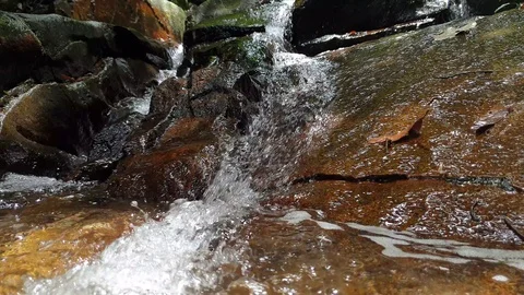 Water flowing over rocks Stock Footage 115219616
