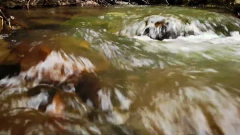 Water flowing over rocks	 Stock Footage 149320729