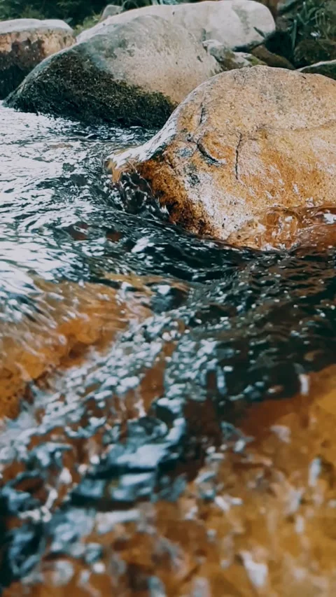 Water flowing over rocks Stock Footage 246137351
