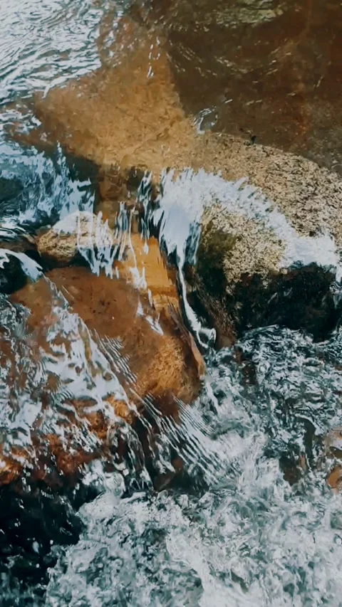 Water flowing over rocks Stock Footage 246139428