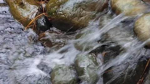 Water flowing over rocks Stock Footage 306766299