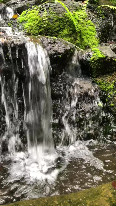 WATER FLOWING OVER ROCKS Stock Footage 332227485