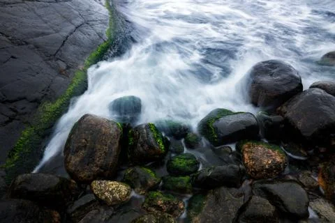 Water flowing over rocks Stock Photos