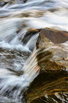 Water flowing over rocks Stock Photos