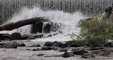 Water flowing over rocks on a river 스톡 동영상 247228412