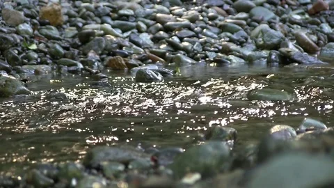 Water flowing over rocks in a stream Stock-Footage 82872457