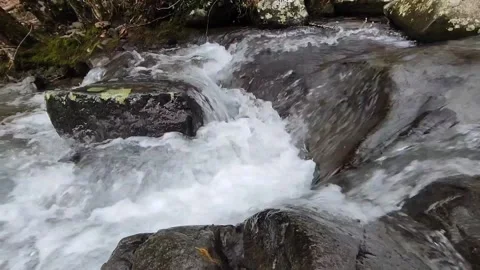 Water flowing over rocks in a stream. Stock Footage 232340232