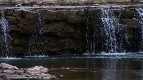 Water flowing over rocky structure Stock Footage 88375666