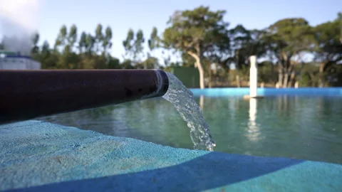 Water flowing from a pipe, illustrating a basic element of water supply Stock Footage 253808396