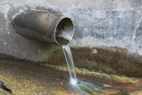 Water Flowing From Pipe Pollution Stock Photos