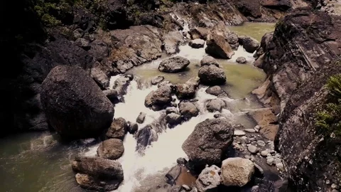 Water flowing on a river with big rocks Stock Footage 101021985