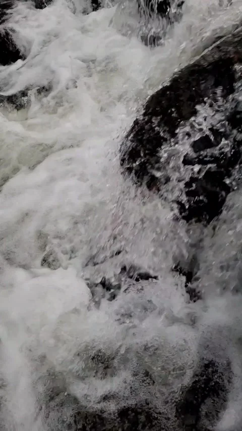 Water flowing into the river Stock Footage 323296358