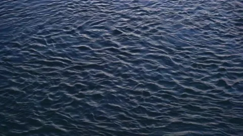 Water flowing in a river at sunset Stock Footage 63140704