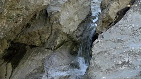 Water Flowing From a Rock Stockbeeldmateriaal 130962467