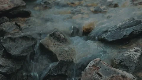 Water flowing in rocks, waterfall Stock Footage 242159172