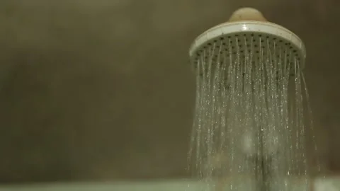 Water flowing from a showerhead in a rustic bathroom, Xinguara, Pará Stock Footage 317793914