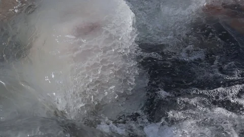 Water flowing by the side of ice block on the river 스톡 동영상 121950512