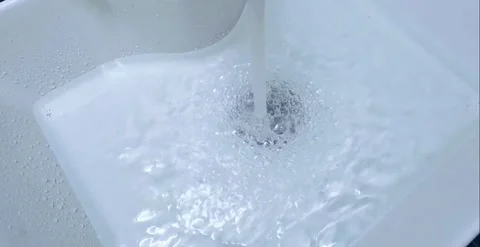 Water Flowing into the Sink Creating Bubbles and Droplets Stock Footage 291700505
