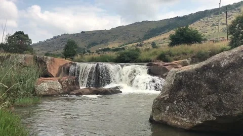 Water flowing slowly through a stream Stock Footage 131844809