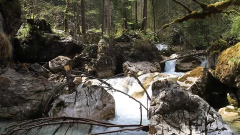 Water flowing in a small river in a tranquil setting Видео 78694441