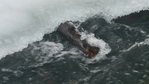 Water flowing into the snow Video stock 168536261