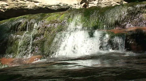 Water Flowing from a Stream Stock-Footage 212360