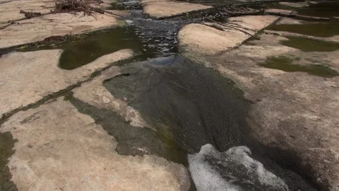 Water flowing stream river rock stone cascade nature afternoon Stock Footage 330468562