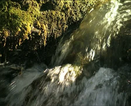 WATER flowing with sun reflections Video stock 12755601