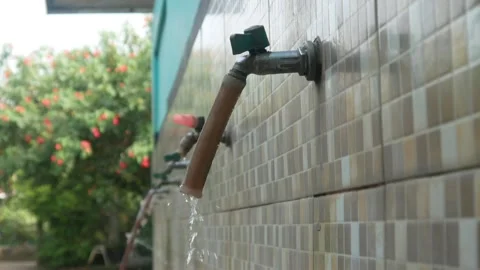 Water flowing from the tap in the ablution area Stock Footage 312904458