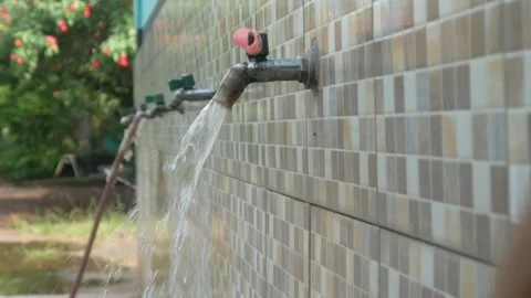Water flowing from the tap in the ablution area Stock Footage 312904459