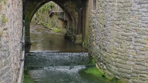 Water flowing through an archway Stock-Footage 280204328