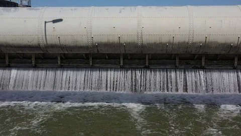 Water flowing through dam of small hydroelectric powerplant, 4K Stock Footage 107374019