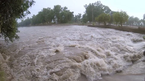 Water flowing through gate in a Canal Stock Footage 99724342