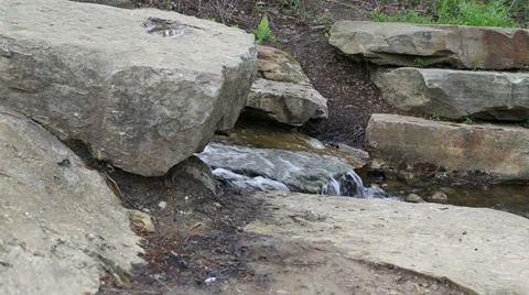 Water flowing through rocks Stock Footage 37729046