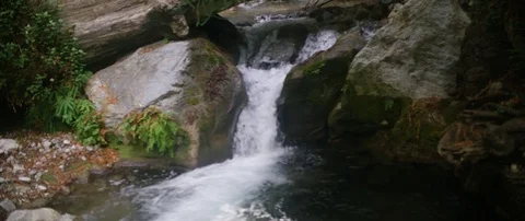 Water flowing through rocks Stock Footage 83825722