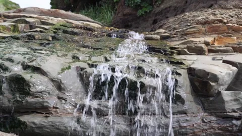 Water flowing through rocks Stock Footage 319907922