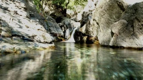 Water flowing through rocks Stock Photos