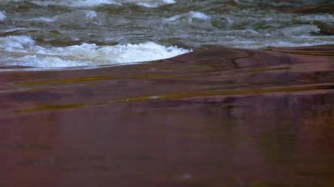 Water flowing through rocks in a river. Stock-Footage 141221350