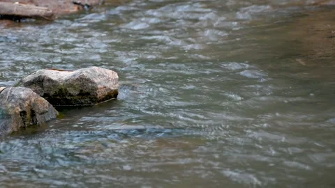 Water flowing through the rocks in the river Stock Footage 246527038